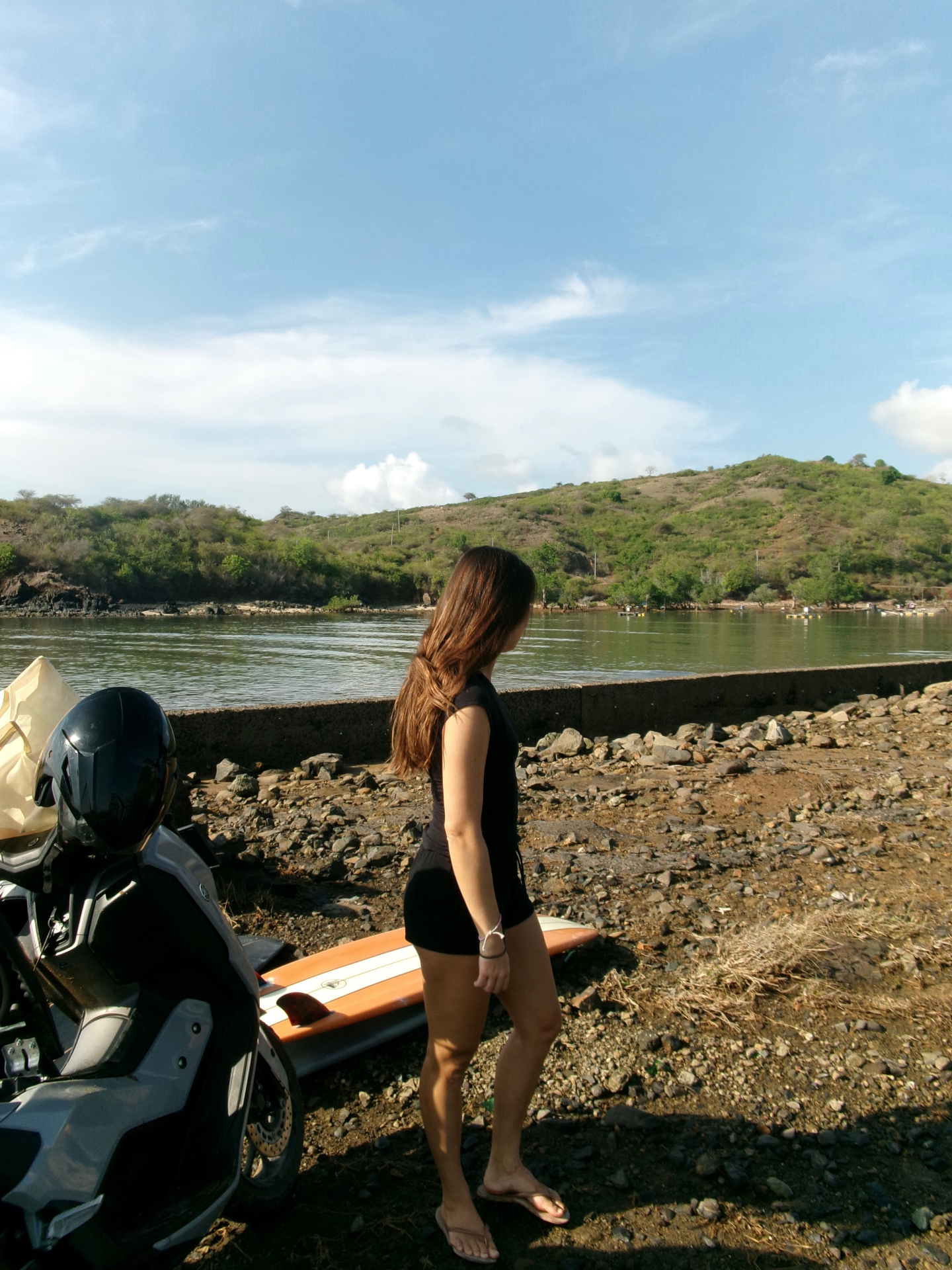Surfer walking to the water at a Kuta Lombok surf spot