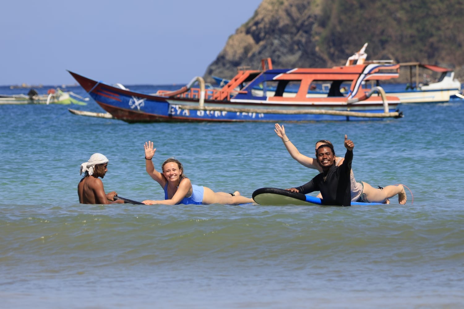 Surfer walking to the water at a Kuta Lombok surf spot